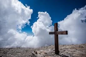 Cross surrounded by clouds